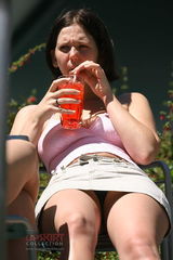 Upskirt flashing. Pretty sitting brunette